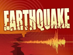 Graphic shows large earthquake logo over broken earth and Richter scale reading