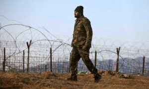 An Indian army soldier patrols near the line of control, the line that divides Kashmir between India and Pakistan, after a reported cease-fire violation, in Mendhar, Poonch district, about 210 kilometers (131 miles) from Jammu, India, Wednesday, Jan. 9, 2013. An Indian army official said Pakistani soldiers crossed the cease-fire line in the disputed Himalayan region of Kashmir and attacked an Indian army patrol, killing two Indian soldiers. While the two nations remain rivals, relations between them have improved dramatically since the 2008 Mumbai siege, in which 10 Pakistani gunmen killed 166 people and effectively shut down the city for days. (AP Photo/Channi Anand)