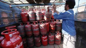 A worker loads domestic LPG cylinder on a truck in Jammu *** Local Caption *** A worker loads domestic LPG cylinder on a truck in Jammu on Thursday.. The Prime Minister-appointed Kirit Parikh committee on February 03 recommended complete decontrol of the petrol and diesel prices and favoured a hike of Rs. 100 a domestic LPG cylinder. Express PHOTO BY AMARJEET SINGH.