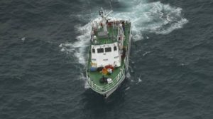 An Indian Coast Guard vessel, top, rescues fishermen in a fishing boat, bottom, that was stranded in the Arabian Sea off the coast of Thiruvananthapuram, Kerala state, India, Friday, Dec.1, 2017. Dozens of fishermen were rescued from the sea which is very rough under the influence of Cyclone Ockhi. (AP Photo)