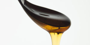 Close up of honey dripping from spoon