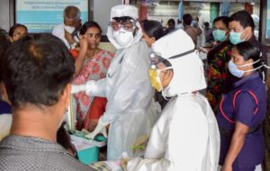 Kozhikode: Family members of the patients admitted at the Kozhikode Medical College wear safety masks as a precautionary measure after the 'Nipah' virus outbreak, in Kozhikode, on Monday. (PTI Photo)(PTI5_21_2018_000184B)