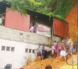 keralanews land slides on the top of the hotel lady trapped in the soil for one and a half hours rescued