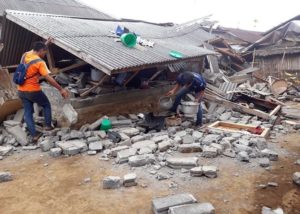 Sembalun :Villagers clear debris caused by an earthquake at Sajang village, Sembalun, East Lombok, Indonesia, Monday, July 30, 2018. A strong and shallow earthquake early Sunday killed more than a dozen people on Indonesia's Lombok island, a popular tourist destination next to Bali, officials said. AP/PTI Photo (AP7_30_2018_000019B)