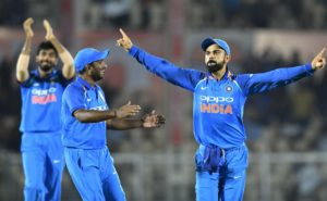 Indian captain Virat Kohli (R) celebrates with teammate Ambati Rayudu after the run out wicket of West Indies batsman Kieran Powell during the fourth one day international (ODI) cricket match between India and West Indies at the Brabourne Stadium in Mumbai on October 29, 2018. (Photo by PUNIT PARANJPE / AFP) / ----IMAGE RESTRICTED TO EDITORIAL USE - STRICTLY NO COMMERCIAL USE----- / GETTYOUT