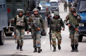 Indian army soldiers patrol a street near a site of a gunbattle between Indian security forces and suspected militants in Khudwani village of South Kashmir's Kulgam district, April 11, 2018. REUTERS/Danish Ismail