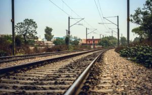 keralanews driver seriously injured when trailer hits the car and car fell down to railway track from over bridge in kochi