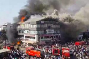 Surat: Smoke billows from the Taxshila Complex after a fire engulfed the third and fourth floor of the coaching centre, in Surat, Friday, May 24, 2019. (PTI Photo) (PTI5_24_2019_000252B)