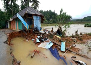 Wayanad: A road and building damaged after flood at Vithiri in Wayanad, in Kerala on Friday, Aug 10, 2018. (PTI Photo)                        (PTI8_10_2018_000231B)