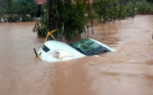 Vythiri: A car is seen submerged in flood water after heavy rainfall, at Vythiri in Wayanad district of Kerala on Thursday, Aug 9, 2018. (PTI Photo) (PTI8_9_2018_000229B)